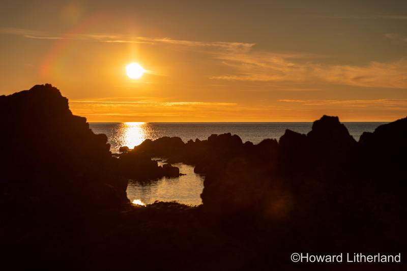 Sunset over rocks, Church Bay, Anglesey, North Wales