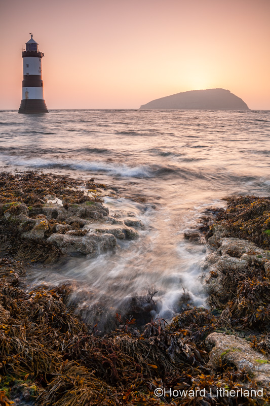 Penmon Point lighthouse and Puffin Island at sunrise, Anglesey, North Wales