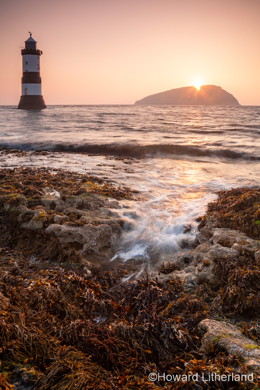 Penmon Point lighthouse and Puffin Island at sunrise, Anglesey, North Wales