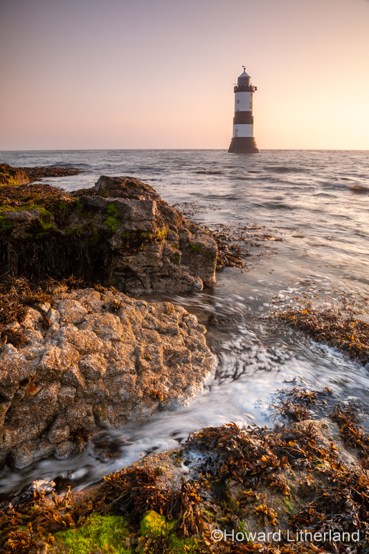 Penmon Point lighthouse at sunrise, Anglesey, North Wales