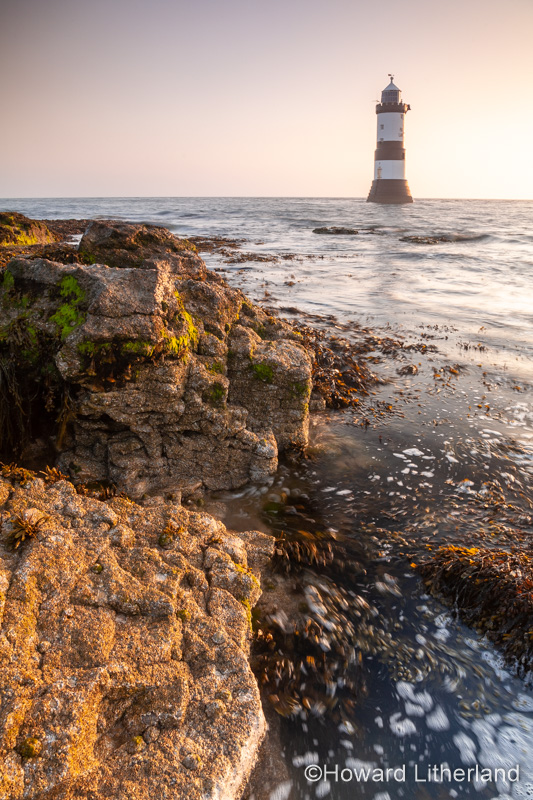 Penmon Point lighthouse at sunrise, Anglesey, North Wales