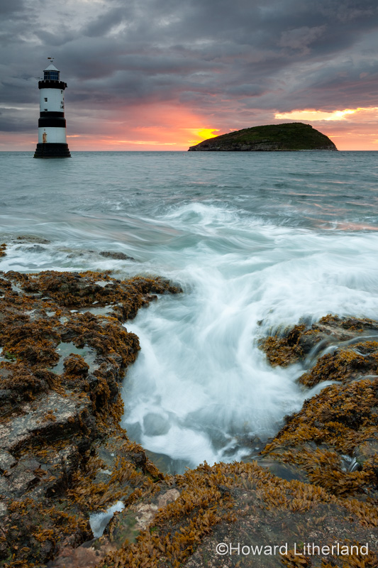 Penmon Point lighthouse and Puffin Island at dawn, Anglesey, North Wales