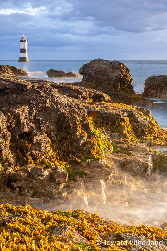 Penmon Point lighthouse in the morning sun, Anglesey, North Wales