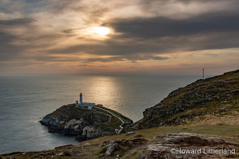 Sunset over the south Stack lighthouse, Anglesey, North Wales