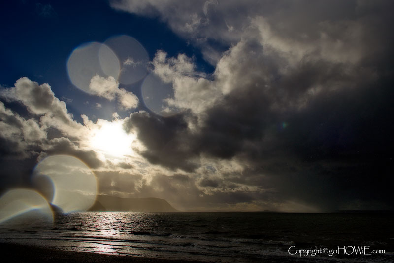 Llandudno West Shore beach with clouds, sun and rain, North Wales coast