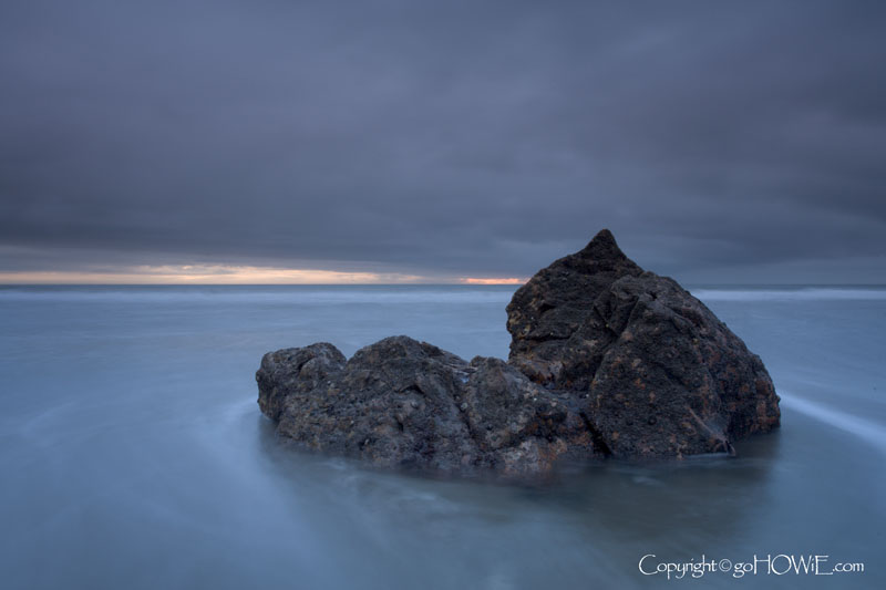 A rock on the beach at dusk, Church Bay, Anglesey, North Wales