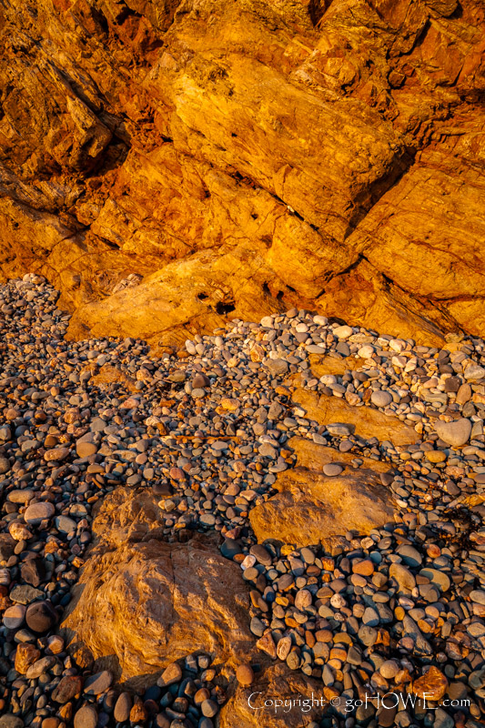 Rocks and pebbles on the beach at Church Bay, Anglesey
