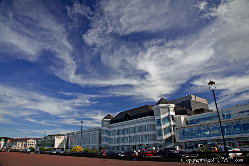 Venue Cymru on the East Shore promenade at Llandudno on the North Wales coast with wispy cirrus clouds overhead