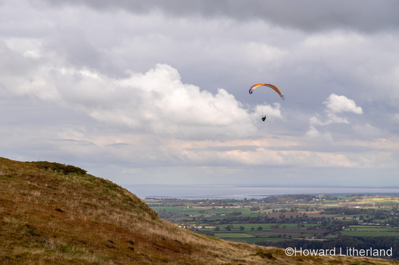 Paraglider over the Clwydian Range, North Wales