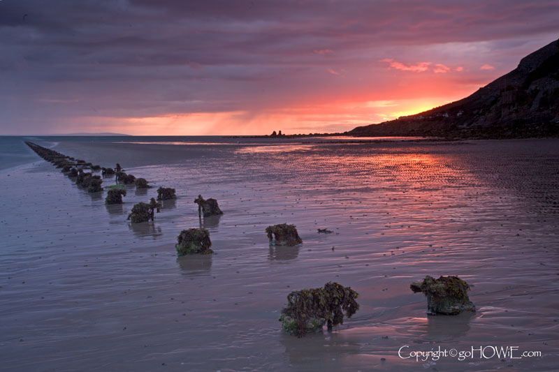 A line of groynes at sunset, Llandudno West Shore, North Wales