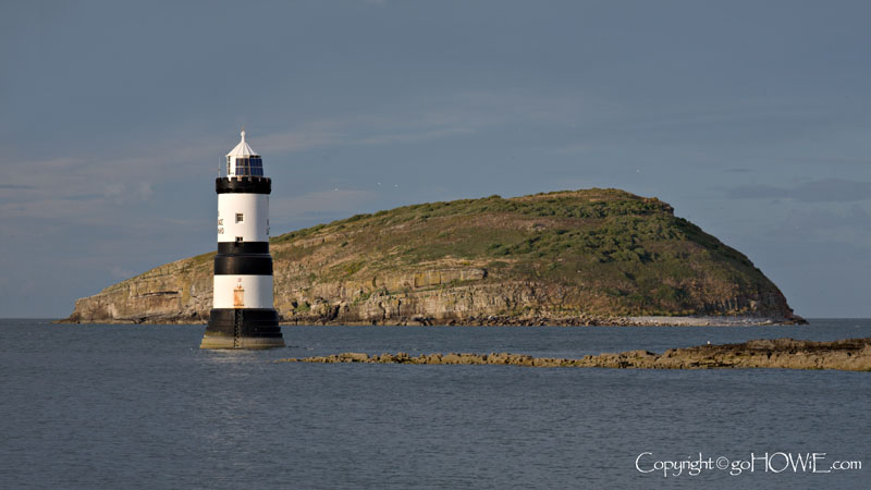 Penmon lighthouse with Puffin Island in the background, Anglesey, North Wales
