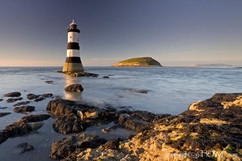 Penmon lighthouse with Puffin Island in the background, Anglesey, North Wales