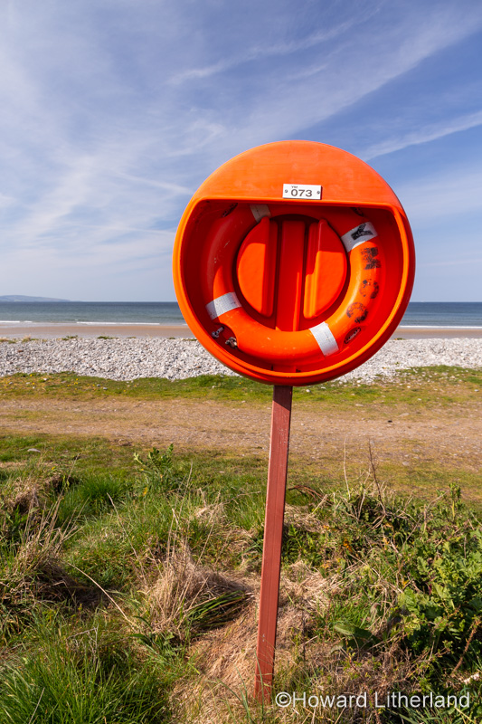 Lifebelt on the foreshore at Llanddona beach, Anglesey, North Wales