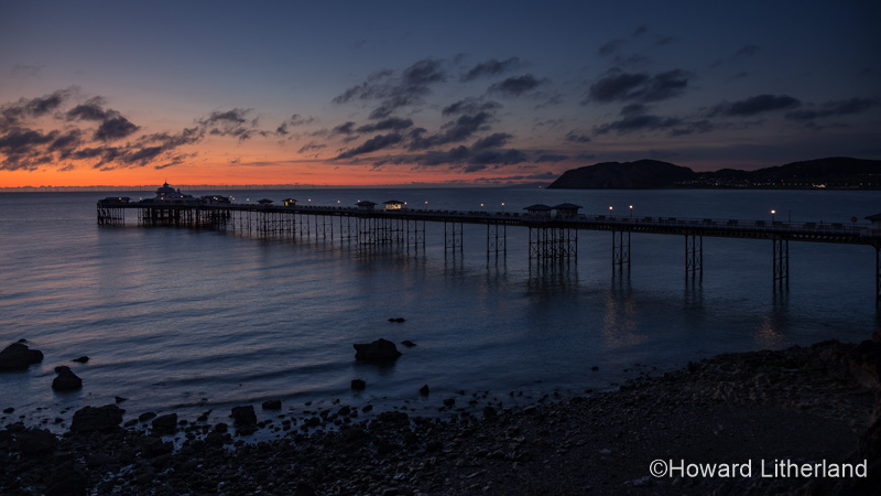 Dawn over the Victorian pier at Llandudno on the North Wales coast
