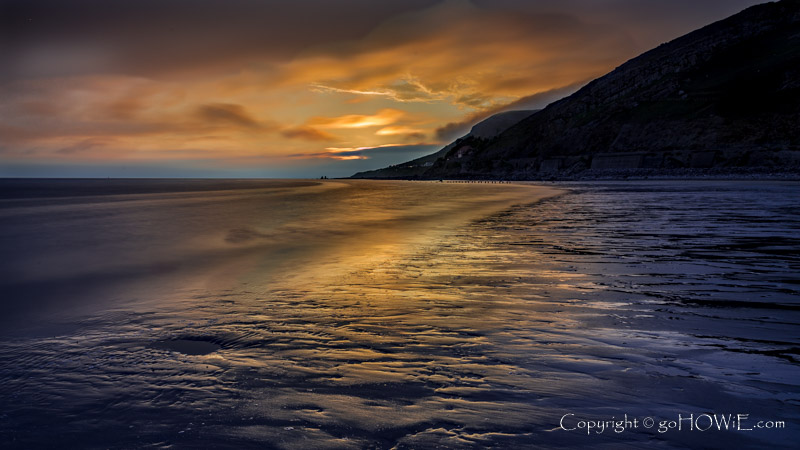 Colourful twilight sky over the West Shore and Great Orme at Llandudno on the North Wales coast