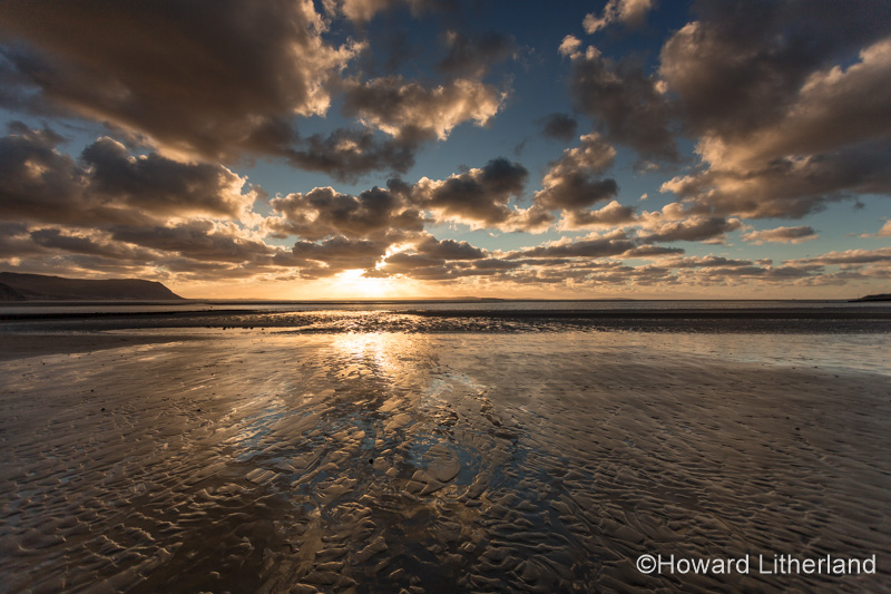 Sunset with clouds over the Irish Sea at Llandudno, North Wales