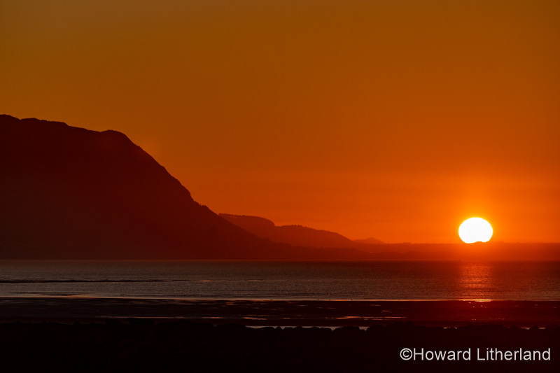 Sunset over the North Wales coast from Llandudno West Shore