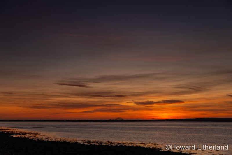 Sunset over the Menai Straits from Caernarfon on the North Wales coast