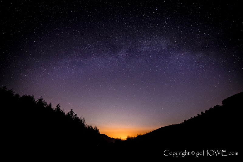 Milky way arching over the Clwydian Range Area of Outstanding Natural Beauty, North Wales