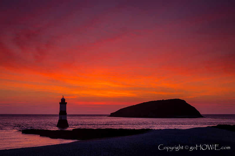 Penmon lighthouse and Puffin Island just before sunrise, Anglesey, North Wales