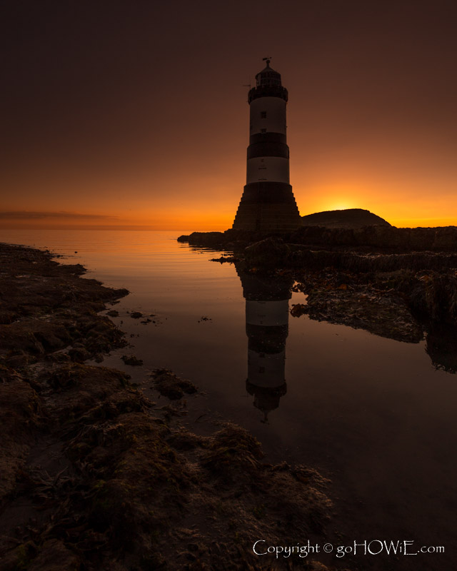 Penmon lighthouse at dawn on a still morning, Anglesey, North Wales