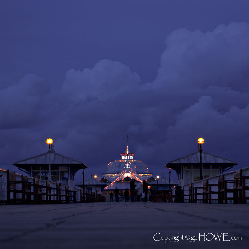 Pavillion on Llandudno pier at dusk as the lights come on, North Wales