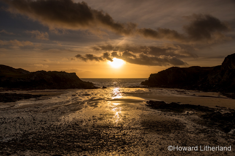 Sunset over the sea at Porth Dafarch, Anglesey, North Wales