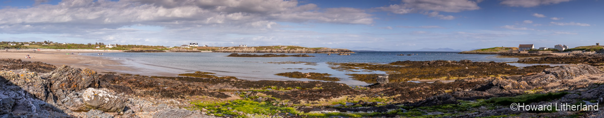 Panoramic view of Rhoscolyn beach, Anglesey, North Wales on a sunny day at low tide