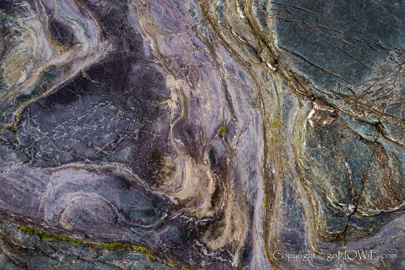 Patterns and colours in rock at Cemlyn Bay, Anglesey, North Wales