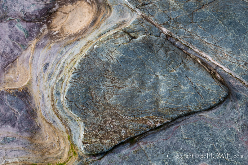 Arrow shaped pattern in rock at Cemlyn Bay, Anglesey, North Wales
