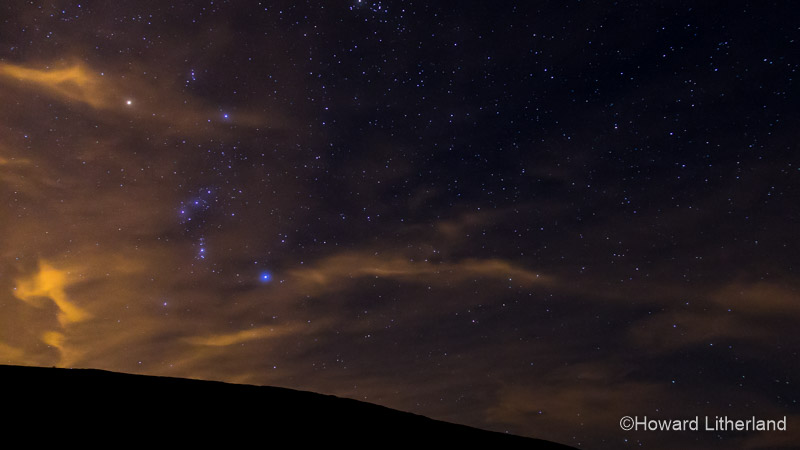 The constellation Orion over Foel Fenlli in North Wales