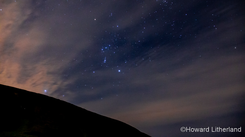 The constellation Orion over the Clywdian Range AONB in North Wales