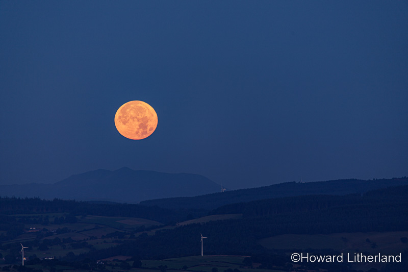 Supermoon setting over the Vale of Clwyd, North Wales