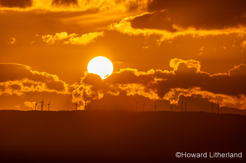 Sunset over wind turbines in the Vale of Clwyd, North Wales