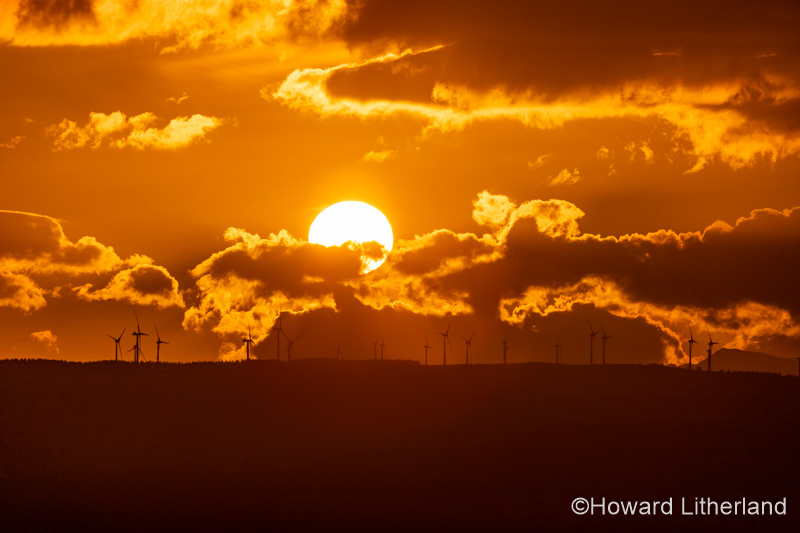Sunset over wind turbines in the Vale of Clwyd, North Wales