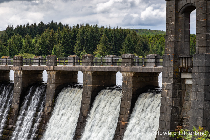 Water overflowing the dam at Alwen reservoir in North Wales