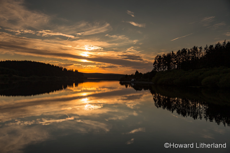 Alwen reservoir with reflections at sunset, North Wales