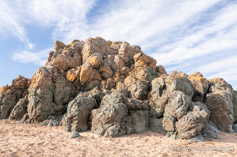Volcanic rock outcrop at Llanddwyn Island, Newborough Beach, Anglesey, North Wales