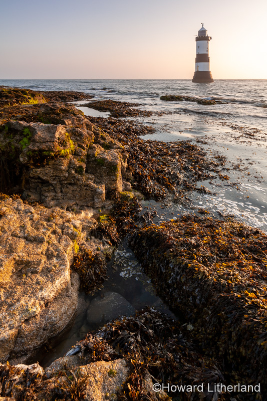 Penmon Point lighthouse at sunrise, Anglesey, North Wales