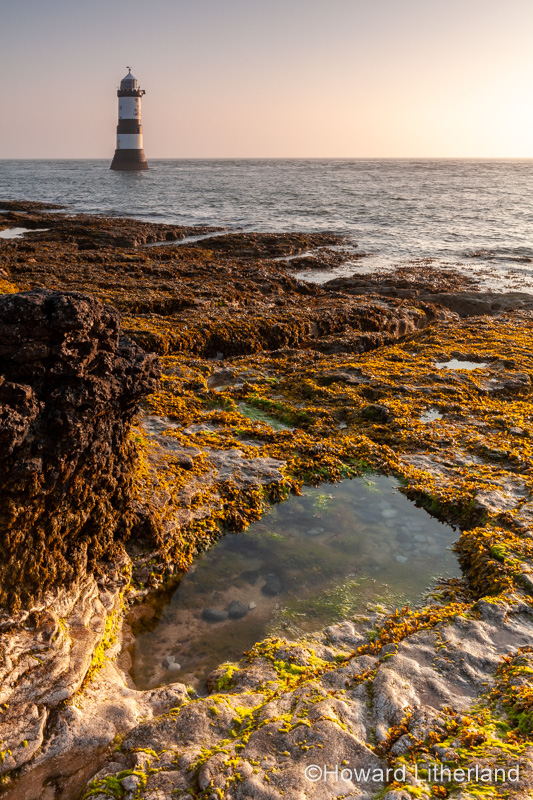 Penmon Point lighthouse at sunrise, Anglesey, North Wales