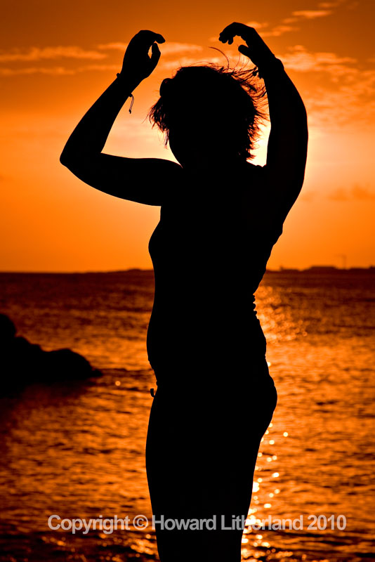 Sillhoutte of girl on beach, St Martin, Carribean