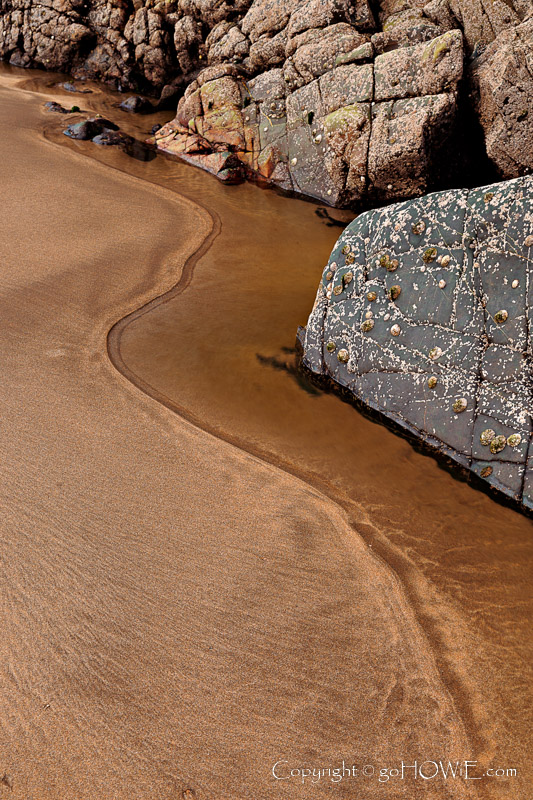 Rock and sand pattern at Solva harbour in the Pembrokeshire National Park, Wales
