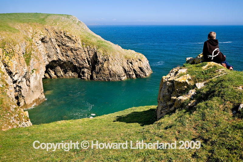 Boy on cliff, Barafundle Bay, Pembrokeshire