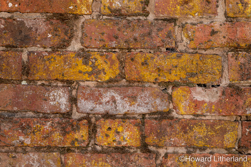 Wall made of old discoloured bricks