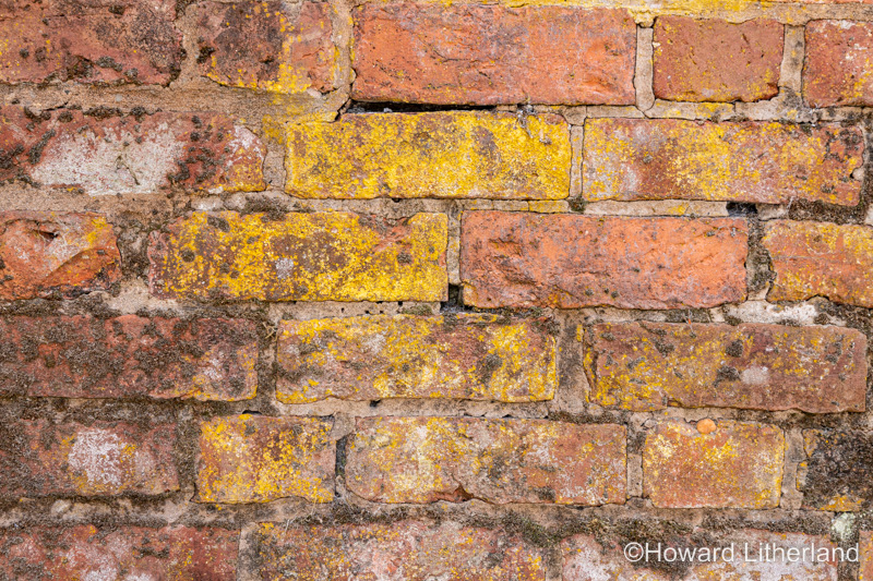 Wall made of old discoloured bricks