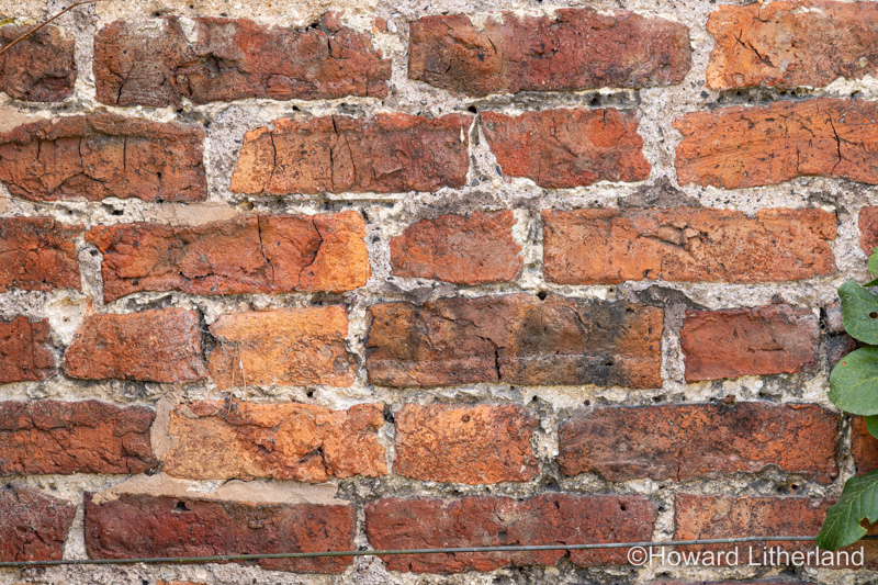 Wall made of old discoloured bricks