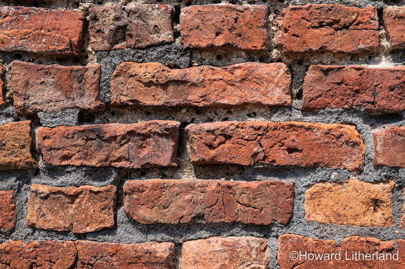 Wall made of old discoloured bricks