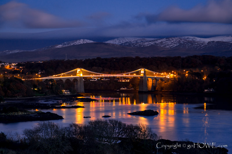 Thomas Telford's iconic suspension bridge over the Menai Straits, North Wales, at dusk