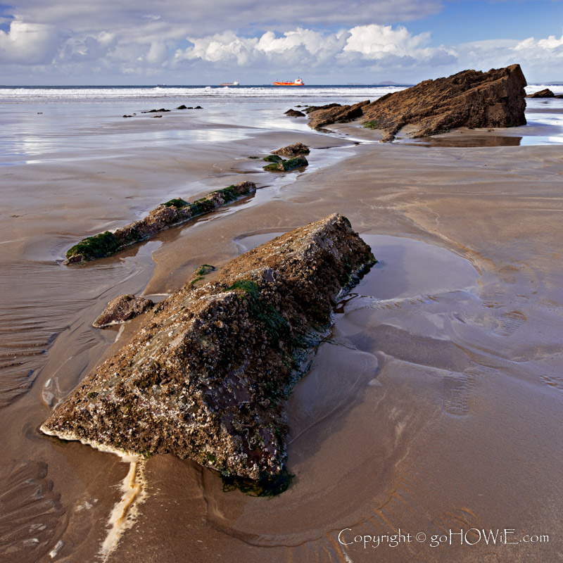 Rocks in the sand on Broad Haven beach, Pembrokshire National Park, Wales