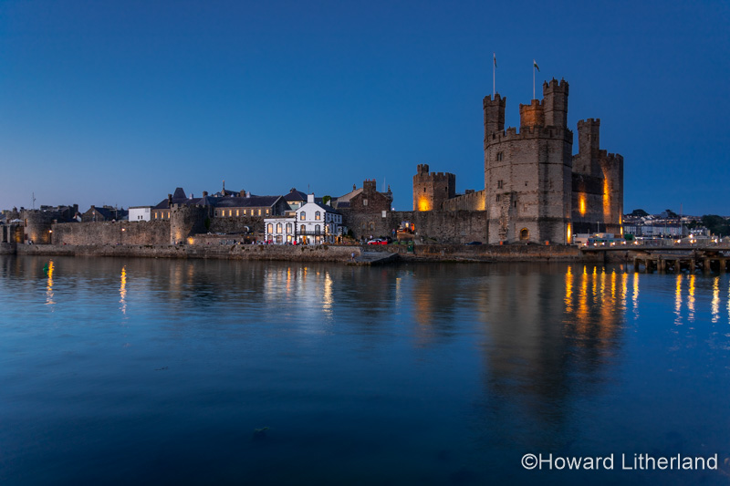 Caernarfon castle at dusk, North Wales coast